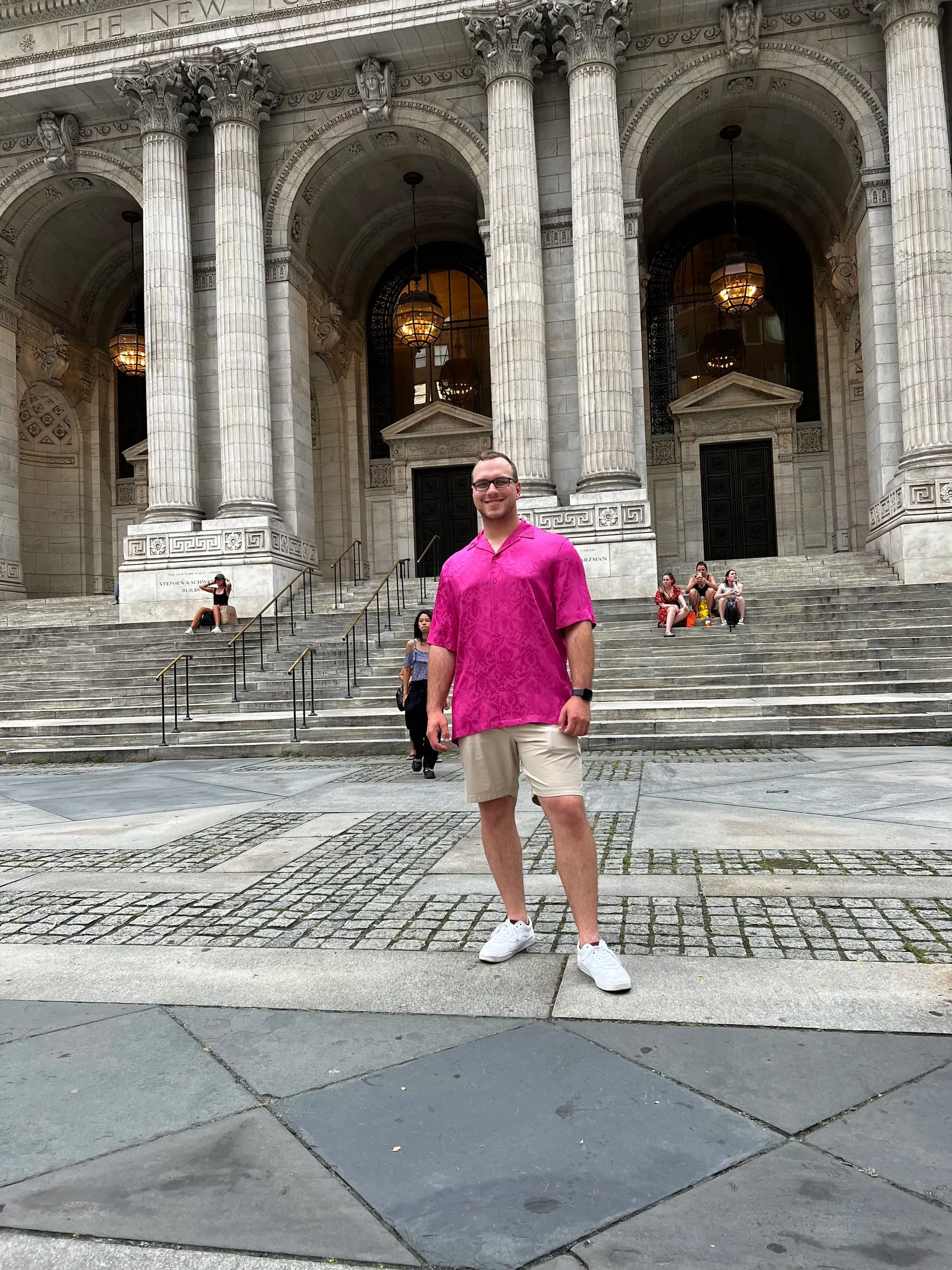 Tyler Henn standing outside the New York Public Library in New York City