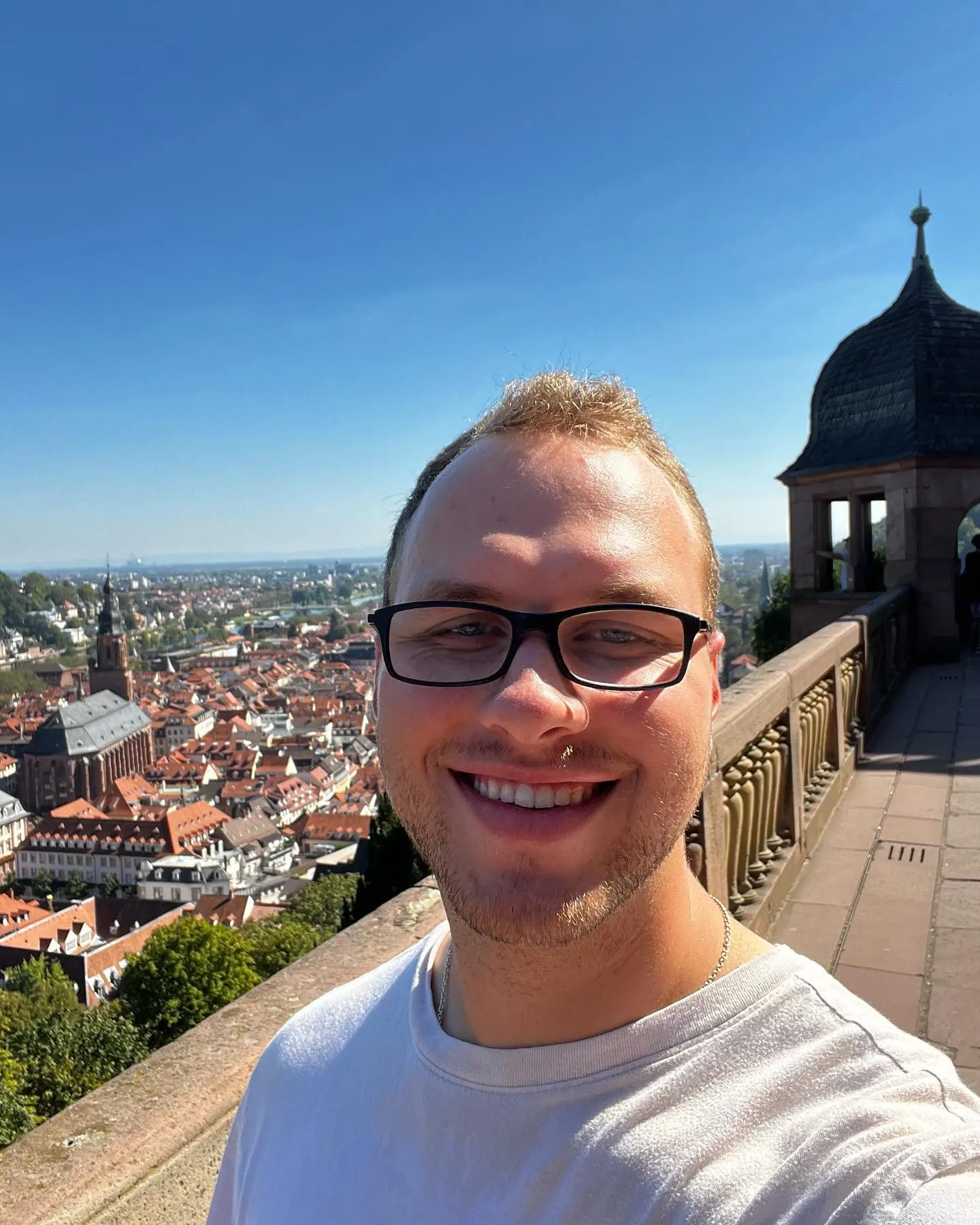 Tyler Henn overlooking the historic center of Heidelberg, Germany, from Heidelberg Castle