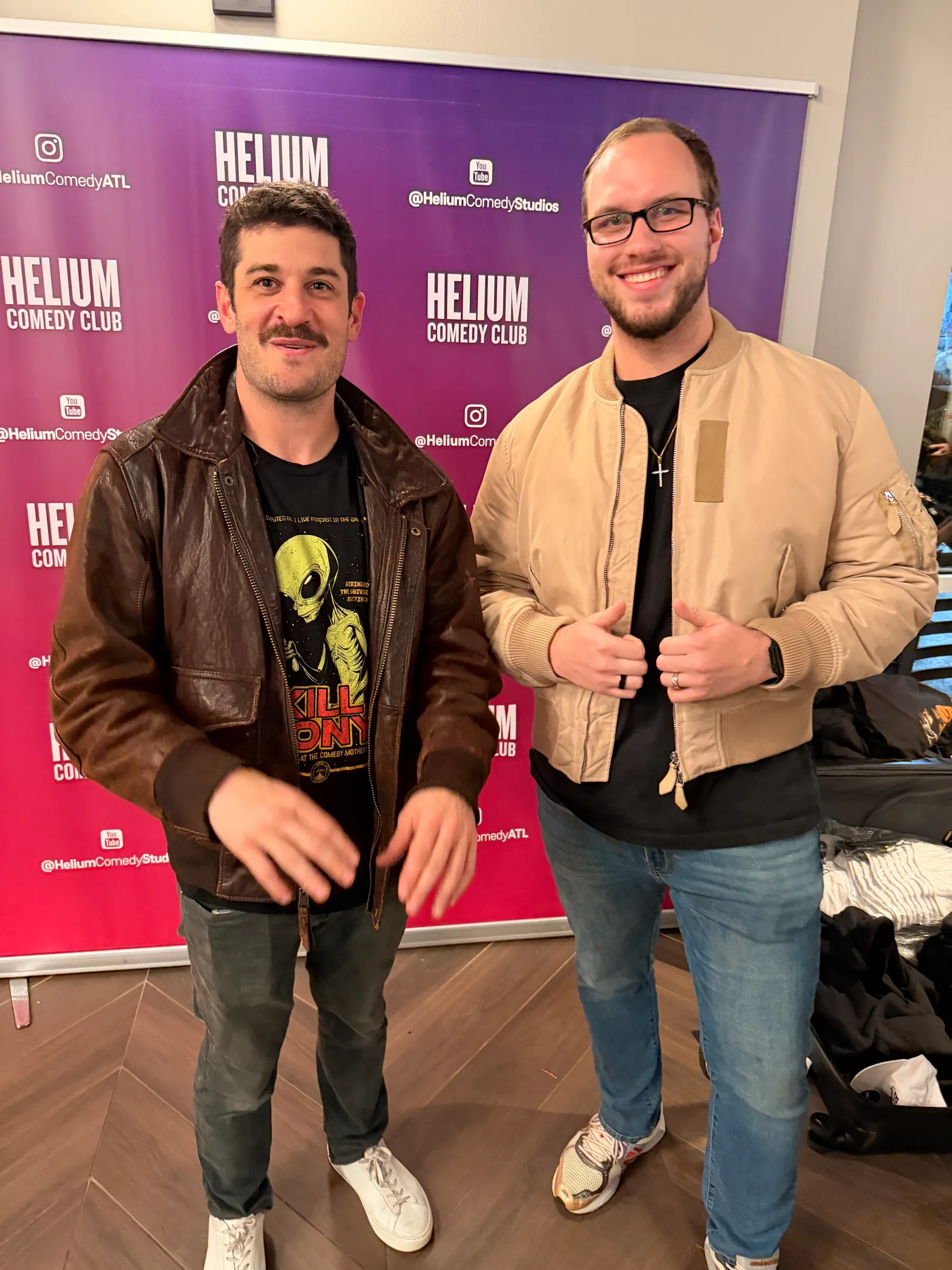 Tyler Henn posing with comedian Timmy No Brakes at Helium Comedy Club in Atlanta, Georgia